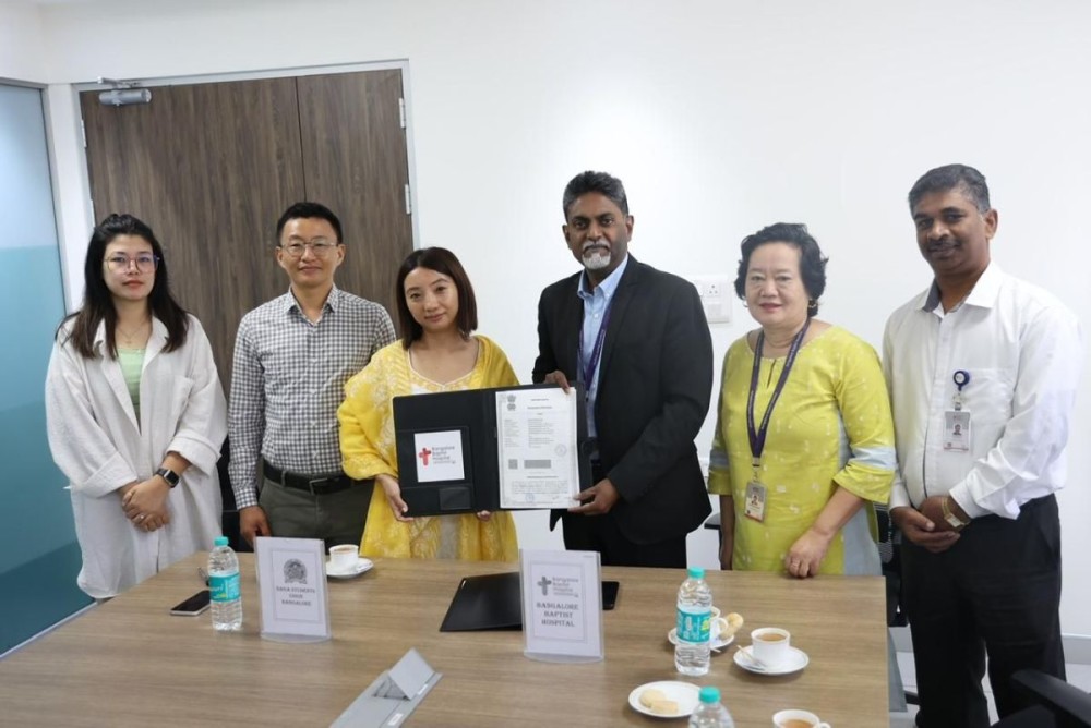 Dr Spurgeon R, Director and CEO of BBH, and Nungsangmongla Ozukum, President of NSUB, in the presence of BBH officials and representatives of the Naga community during the signing of MoU for affordable healthcare services.